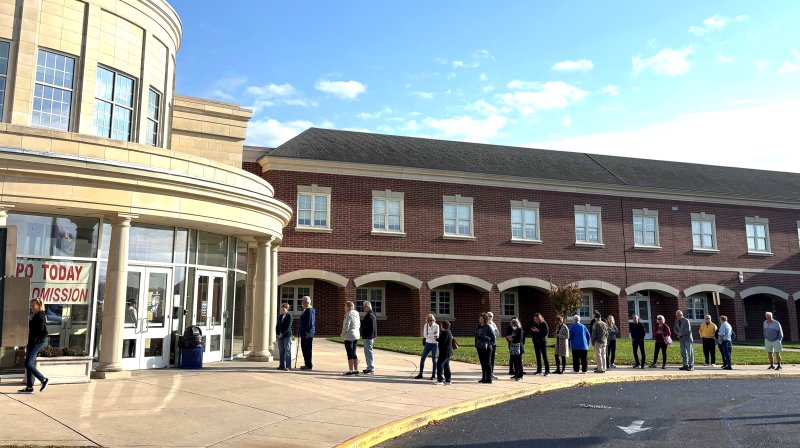Visitors line up early for entrance to the 55+ Expo.